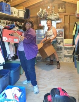 Carol and Heather Straightening the Clothes Closet