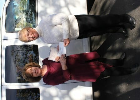 Executive Directors Exchange Check and Title for New Trinity Center Van